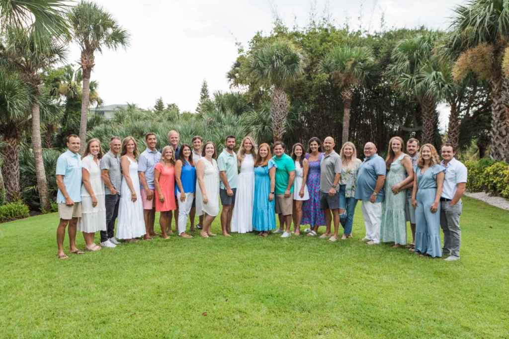 The Cathy family smiling together in a formal setting.